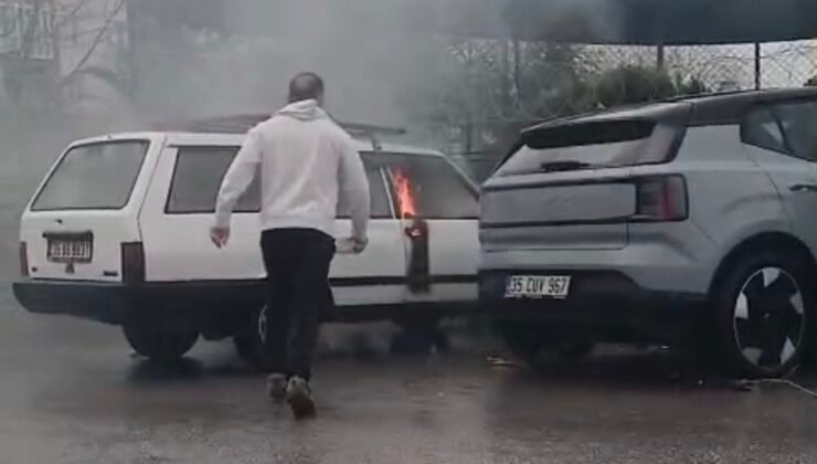 Yanan otomobile yol kenarındaki su birikintisinden doldurduğu kovayla müdahale etti